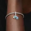 A close-up shot of a person's arm wearing a Pandora bracelet with a chameleon charm. Anteprima dell’immagine prodotto
