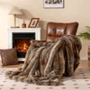 A cozy living room scene with a fireplace, armchair, and a plush blanket. Náhled obrázku produktu