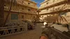 A first-person perspective of a combat scene in a desert-like environment, with buildings and a person firing a weapon. Produktbild-Vorschau