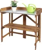 A wooden potting table with a metal top, a potted plant, and a watering can. Náhled obrázku produktu