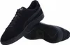 A pair of black Puma sneakers shown from a slightly elevated side angle, with one shoe placed in front of the other. Podgląd zdjęcia produktu