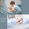 A collage showing a child sleeping with a teddy bear and a woman sleeping in a bed, with text overlay on the left side. Produktbild-Vorschau
