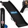 A black dog ramp is shown in a studio setting, with a smaller folded version and a blue collapsible bowl to the left. A smaller inset image shows a dog using the ramp to get into a car. Produktbild-Vorschau