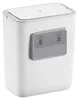 A white trash can with a gray mounting bracket with suction cups attached to the side. Produktbild-Vorschau