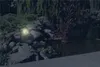 A solar-powered garden light illuminates a rocky pond area at dusk. Anteprima dell’immagine prodotto