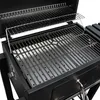 A close-up view of the interior of a black charcoal grill, showing the cooking grates. Podgląd zdjęcia produktu