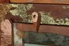 A close-up view of a wooden furniture piece, showing a detail of its construction and materials. Náhled obrázku produktu