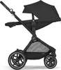 A black Cybex Eos Lux stroller shown from the side against a white background. Voir les images du produit