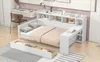 A modern white daybed with integrated shelving and a desk area, shown in a bedroom setting with a desk and chair in the background. Produktbild-Vorschau