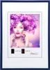 A woman with a large floral hairstyle and butterflies, presented within a blue picture frame. Produktbild-Vorschau