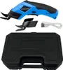 A blue and black electric fabric cutter, its accessories, and a black carrying case are displayed against a white background. Náhled obrázku produktu