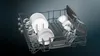 The top rack of a dishwasher filled with clean dishes, glasses, and bowls. Produktbild-Vorschau