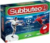 The image shows the box of a Subbuteo Champions League Edition table football game, featuring two players in action on a stadium background. Produktbild-Vorschau