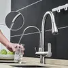 A person is filling a glass with water from a kitchen faucet. Náhľad obrázku produktu