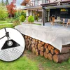 A white tarp covers a stack of firewood in a backyard setting, with a house and patio visible in the background. Anteprima dell’immagine prodotto