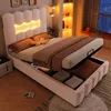 A modern bed with storage and LED lighting in a bedroom setting. Produktbild-Vorschau