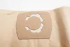 A close-up of a vacuum cleaner bag with a circular connector. Produktbild-Vorschau