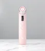 A pink beauty device with a silver top and a small screen is placed on a marble surface against a light gray background. Náhľad obrázku produktu