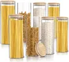 A collection of glass storage jars filled with pasta and grains, with bamboo lids. Náhled obrázku produktu