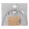 A baby play mat with a play arch and toys, shown inside its clear plastic packaging. Produktbild-Vorschau