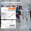 A group of people are blurred in the background, with a clear acrylic podium in the foreground. There are inset images highlighting the thickness of the acrylic. Náhled obrázku produktu