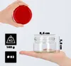 A hand holding a red lid above a glass jar, with dimensions and weight information displayed. Produktbild-Vorschau