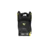 The back view of a black and yellow Puma safety boot. Voir les images du produit