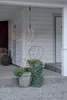 Three spherical LED lights are displayed on a porch with plants and a potted plant. Produktbild-Vorschau