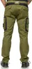 A person wearing green Puma workwear pants. Produktbild-Vorschau