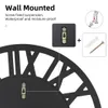 Close-up of a wall clock's mounting mechanism and instructions for wall mounting. Anteprima dell’immagine prodotto