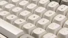A close-up view of a white mechanical keyboard. Produktbild-Vorschau