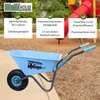 A blue children's wheelbarrow with a fire truck decal, set against a playground background with mulch and a slide. Produktbild-Vorschau