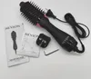 A Revlon Salon One-Step Hair Dryer and Volumizer is laid out on a white background with its accessories and instruction manuals. Podgląd zdjęcia produktu