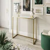 A console table with a marble top and gold frame is placed in a hallway or living room setting, decorated with a bust and a lamp. Náhľad obrázku produktu