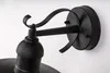 A close-up view of a black outdoor wall light fixture. Anteprima dell’immagine prodotto