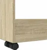Close-up of the bottom corner of a wooden storage unit with a wheel. Náhľad obrázku produktu