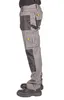 A person wearing work pants and shoes, shown from the side. Náhled obrázku produktu