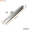 A metal flame tamer for a grill, shown with measurement indicators and a screw. Voir les images du produit