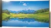 A scenic landscape with mountains, a lake, and green hills, printed on a retractable screen. Náhled obrázku produktu