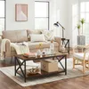 A living room scene featuring a couch, coffee table, and chair. Produktbild-Vorschau
