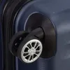 A close-up view of the wheels of a blue suitcase. Produktbild-Vorschau