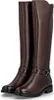 A pair of brown leather boots. Voir les images du produit