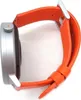 Side view of a smartwatch with an orange strap. Voir les images du produit