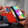 A person is holding a red flip-cover phone case with a Samsung Galaxy A41 inside. The case has card slots and is open, showing the phone screen and some cards and cash. Produktbild-Vorschau