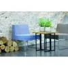 A modern living room setting with blue and gray chairs, a wooden side table with potted plants, and a stack of logs. Produktbild-Vorschau