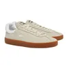 A pair of beige Lacoste sneakers with brown soles, shown from a side angle against a white background. Produktbild-Vorschau
