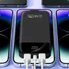 A black power bank is shown charging multiple smartphones. Produktbild-Vorschau