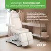 A white cosmetic chair is shown in a room with a shelf of beauty products in the background. Produktbild-Vorschau