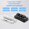 Two mini keyboards, one white and one black, are displayed on a light gray surface. Text overlays describe the features of the keyboards. Produktbild-Vorschau