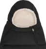 A close-up view of the hood of a black baby stroller footmuff, lined with cream-colored faux fur. Produktbild-Vorschau